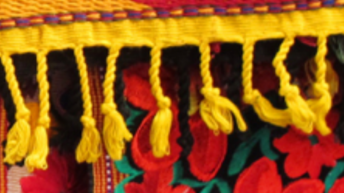 Standard Image for HLHM, a yellow and red fabric and rug