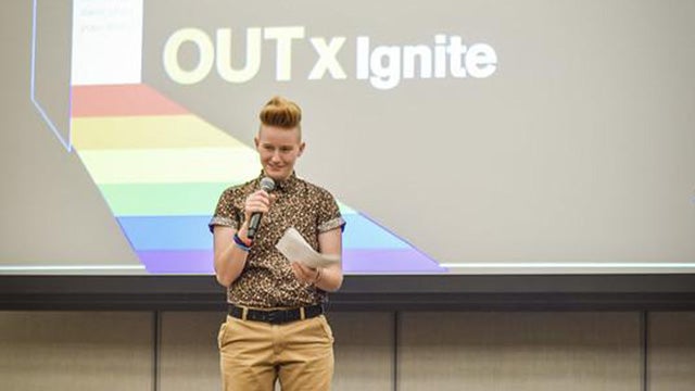 A student onstage at ASU's OUTxIgnite storytelling event for Fall Pride Week 2019