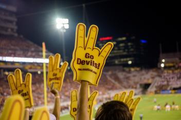 Go Devils foam hand at a football game