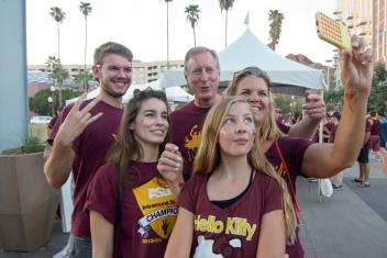 Students taking a 'selfie' with their family and friends